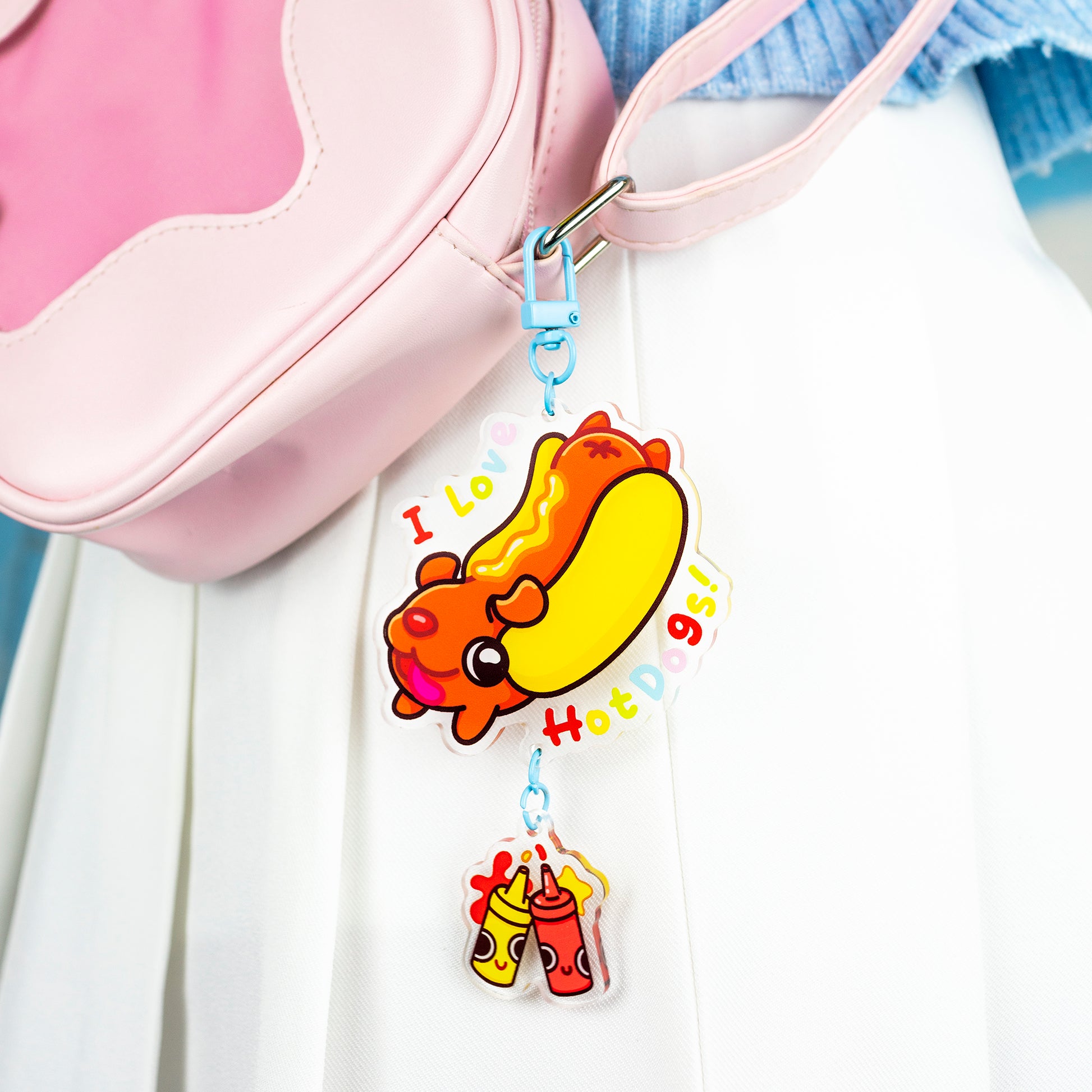 Hotdog keychain shown clipped to bag