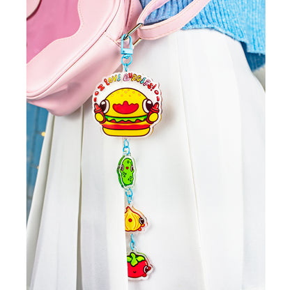 Burger Keychain clipped to a purse