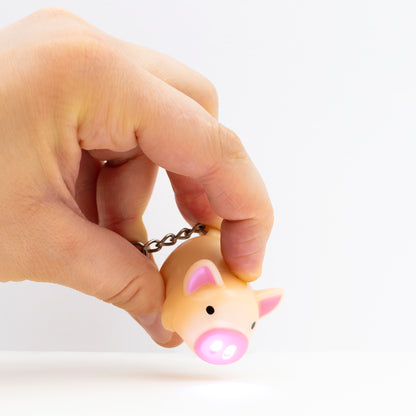 Piggy keychain with flash light on