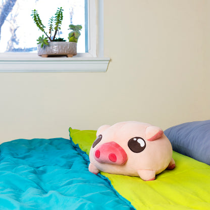 Kawaii plushie piggy stuffed animal on a bed