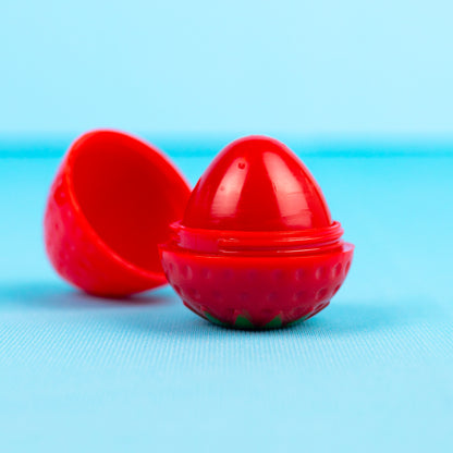 Strawberry lip balm with cap taken off